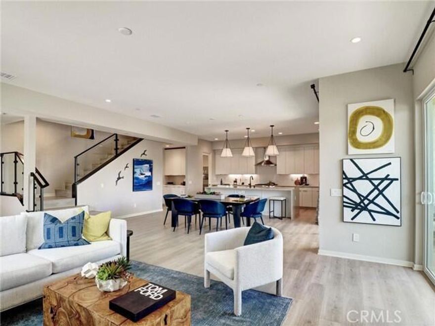 NEW BUILD LUXURY TOWNHOME with Palm Springs mere minutes from your front door! A bike ride, a stroll, or a moment's drive down Palm Canyon Drive and you are there! MOVE-IN READY with special Seller arranged financing available. FEE SIMPLE OWNERSHIP (not on leased land) and all the modern conveniences of new home construction, including an owned Solar system. Located in the new home community of Elan, visually framed by the breathtaking San Jacinto Mountains, this 2 Bedroom, 2.5 Baths and 2 car garage townhome boasts many interior upgrades, including a Glass Stair Rail, Light Gray Polished 12 x 24 tile flooring on the first floor, large quartz waterfall edged kitchen island including bar seating. Thermofoil cabinets with soft maple interiors and Grenada finish throughout home, includes soft close drawers and cabinets, full custom backsplash in kitchen, Stainless steel Bosch appliance package with free standing gas range with 6 burners, pyramid wall canopy hood, built -in Bosch microwave, dishwasher and single basin stainless-steel sink. Prewired for Whole house WI-FI with 2 access points, recessed lighting upgrades in all living areas, upstairs Laundry Room. Voluminous 9' and 10' ceilings, superb quality Milgard windows, fully insulated 2-car garage with steel roll up garage door, WI-FI garage door opener, including camera and Amazon MyQ/key. Ring doorbell included, pre-wired for ceiling fans in all living areas, pre-wired for a pair of speakers in the Great Room and upper deck. Private patio at first level and balcony off of all upstairs bedrooms. Pictures are of the model home for this floor plan and not the home offered for sale. Community amenities include a resort style community pool, dog park and bocce ball court.