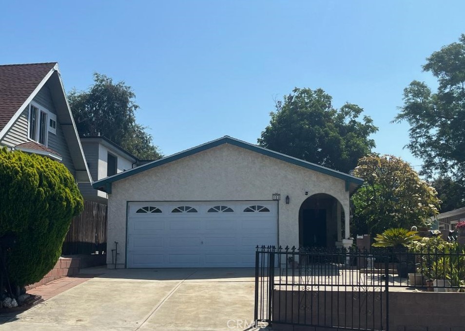 Located in the highly desirable Highland Park neighborhood—just minutes from Los Angeles, Eagle Rock, and Pasadena—this unique property offers comfort, character, and versatility. A gated driveway with space for two or more vehicles leads to a covered arched entry and charming landscaped nooks throughout the property. The inviting arched front entrance opens into a cozy living room featuring wood laminate floors, recessed lighting, and a prominent wood-burning fireplace, creating a warm and welcoming atmosphere. The main home offers three spacious bedrooms and two full bathrooms within a total of approximately 2,600 square feet, which also includes two attached rental units. Each unit features a private rear entrance, one bedroom, a full bathroom, and a kitchen—perfect for rental income, guests, or multigenerational living. Through a second graceful archway from the living room, you’ll find a large family kitchen and dining area with granite countertops, upgraded cabinetry, and direct garage access. The home has been thoughtfully upgraded throughout, blending classic charm with modern convenience.