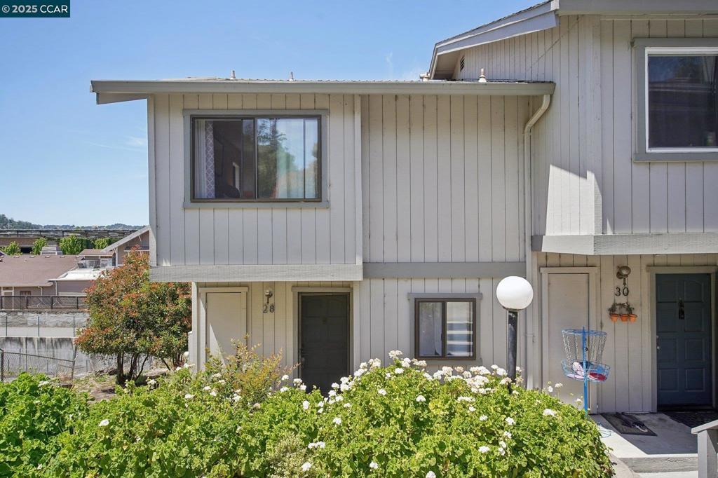 Nestled in Walnut Creek’s coveted Overlook neighborhood, move in ready end unit! This townhome is one of an exclusive 7-home community—offering unmatched privacy just minutes from vibrant downtown. The light-filled main level boasts a spacious living room with a wood-burning fireplace, an open dining area, a well-appointed kitchen with abundant storage, and a powder room with in-unit laundry. Two private decks—one on each level—invite indoor-outdoor living, perfect for morning coffee or relaxing evenings. Upstairs, find two oversized bedrooms and a full bath—one with a walk-in closet, the other with a full wall of storage. With fresh interior paint, newer carpet, and updated appliances, this home is move-in ready. A detached 1-car garage provides added convenience and flexibility. Enjoy easy access to downtown Walnut Creek’s shops, restaurants, parks, BART, and Iron Horse Trail—plus zoning for top-rated Walnut Creek schools. This is a rare opportunity to own a well-cared-for townhome in a quiet, sought-after location that combines value, comfort, and lifestyle. Don’t miss this darling home!