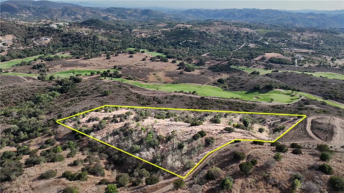 Perched high above Cross Creek Golf Course, this stunning 7.64-acre vacant lot in De Luz offers breathtaking golf course and hillside views, perfect for an estate home, vineyard, or avocado grove. Previously a grove with trees cleared, the property features a rough-cut building pad. Surrounded by multi-million dollar estates, this parcel on lightly traveled, unpaved La Casita Road ensures privacy and seclusion, with great southern exposure ideal for sustainable solar living. Just minutes from Old Town Temecula, this rare gem combines serenity, potential, and proximity—priced to sell quickly! APN# 935-210-024