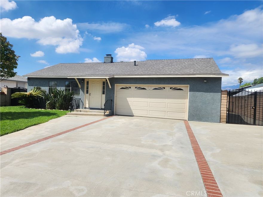 Welcome to this charming West Covina home, perfectly situated in a tranquil neighborhood with easy access to shopping and freeways. This 3-bedroom, 2-bathroom residence offers an ideal layout for both daily living and entertaining.  Step inside and discover a spacious living room bathed in natural light, complete with a cozy brick fireplace and elegant wood shutter windows. The formal dining room opens directly to a private backyard, creating a seamless flow for indoor-outdoor living. The kitchen is ready for your culinary adventures with a new hood and a newer range and dishwasher.  The thoughtful floor plan separates the private master suite, complete with its own bathroom, from two additional bedrooms and a shared bathroom. A dedicated laundry area is conveniently located inside the home. Outside, the possibilities are endless with a bonus room—perfect for a home gym, a quiet office, or a creative workshop. The large patio and ample parking, including a two-car garage, complete this wonderful home.