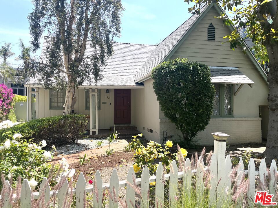 Hollywood-Hancock Pk adjacent. English storybook cottage filled with warmth and charm and drenched with natural light. As you walk along the brick path to the house you are greeted by a inviting front porch. This home is near Melrose and Highland with great walkability to restaurants, shops and minutes to Larchmont Village. This home features 3 bedrooms, 2 bathrooms with formal dining room. Lovely living room anchored by fireplace and a one of a kind leaded glass window. Original hardwood floors and moldings throughout the house. There is a pleasant breakfast nook with lovely views of the bougainvillea making it a perfect spot to enjoy enjoy your morning coffee. Bathrooms have been renovated with dual vanities. There is a detached finished two car garage with tons of possibilities for additional space. The backyard is fenced and private to enjoy our great weather. This one is a catch!