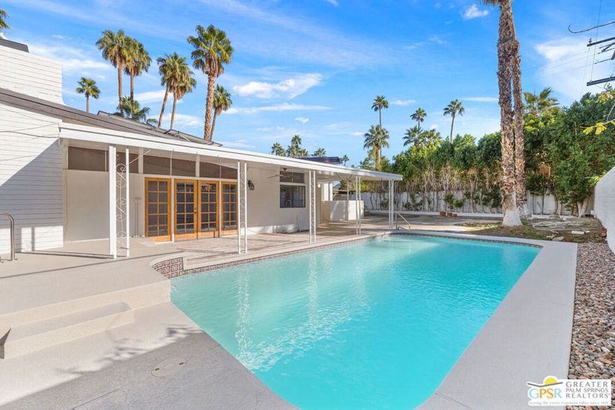A true mid-century modern opportunity in one of South Palm Springs' most cherished architectural neighborhoods: Twin Palms. Built in 1958 by the famed Alexander Construction Company, this classic "Butterfly Alexander" showcases the iconic roofline, soaring vaulted ceilings, tongue-and-groove exposed beams, and clerestory windows that frame swaying palms and dramatic mountain silhouettes. Set on land you own (no land lease) and no HOA, the property offers tremendous architectural potential along with immediate lifestyle perks. The west-facing backyard captures the best of Palm Springs sun and scenery and features a freshly resurfaced pool and spa, updated equipment, and owned solar panels for year-round efficiency. Inside, the traditional mid-century floor plan includes a west-facing dining area and a living room with fireplace, an adjacent kitchen with backyard access and exterior views, and a classic bedroom layout that includes a Primary Ensuite plus two guest bedrooms with a nearby hall bath. The original footprint has been expanded to add a casual living space with a bar that opens to the backyard: a great foundation for indoor/outdoor entertaining. Move-in updates include new interior and exterior paint, a new water heater, and a new garage door. With its architectural pedigree and prime location, this is the ideal canvas for someone ready to bring a classic Butterfly Alexander forward into 2026. Even better: the property qualifies for a Vacation Rental Certificate, offering short-term rental possibilities for investors or part-time residents. This is a rare chance to restore, reimagine, and celebrate one of Palm Springs' most recognizable mid-century forms - all in a neighborhood beloved by enthusiasts from around the world.