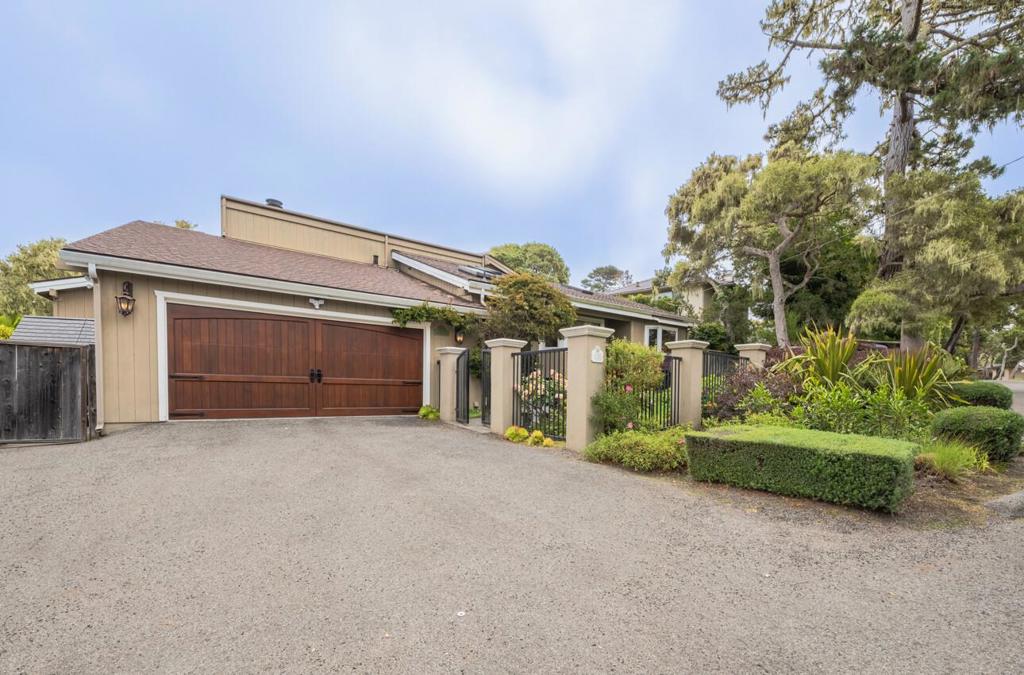 Discover timeless elegance and modern comfort in this beautifully designed Pebble Beach home, set on a generous 9,900 sq ft lot. Offering 4 spacious bedrooms and 3.5 luxurious bathrooms, this 3,682 sq ft residence is filled with natural light and distinctive architectural details. Step into the impressive great room, where a soaring fireplace and a striking glass ceiling with multiple skylights through the home create a bright, airy atmosphere perfect for entertaining or relaxing. Vaulted ceilings and rich hardwood floors add warmth and sophistication throughout the home. The expansive primary suite is a true retreat, featuring its own fireplace, a comfortable sitting room, and spa-inspired en suite bath. Outdoor living is just as inviting with expansive decking that spans the back of the homeideal for gatherings or quiet moments surrounded by nature. Additional highlights include a 2-car garage, plenty of off-street parking, and mature landscaping for privacy and curb appeal.