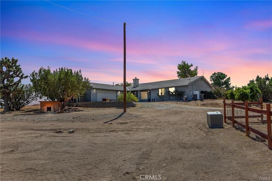 ***Beautifully Renovated Oak Hills Horse Property***
Welcome to this stunning open-concept home featuring gorgeous dark flooring, a cozy wood-burning stove with stone hearth, and ceiling fans throughout**Enjoy spacious rooms filled with natural light and breathtaking views of both the mountains and city lights**
***Just off the kitchen is a sunroom (not included in square footage) perfect for relaxing year-round/Office/Playroom or just that additional square footage that is needed***A massive indoor laundry room with ample cabinetry adds convenience and functionality***
***Situated on a large lot in the highly desirable Snowline School District, this property is ideal for those seeking space and versatility** With fenced areas for goats, pigs, and chickens (complete with a chicken coop), it’s ready for homesteading or hobby farming***There is a fenced yard, mature trees, and wide-open views complete the setting**Bring your toys, animals or big trucks, this one has room for it all!!