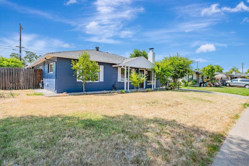 Enveloped in the quiet charm of Sacramentos Tallac Village, this 4-bedroom, 2-bath home is a study in thoughtful simplicity and everyday comfort. A crisp navy facade and mature greenery create a dignified curb presence, while inside, natural light filters through generous windows, casting warmth across the clean lines and solid surfaces that define each space. The living and dining areas invite quiet moments and conversation alike, anchored by a dark brick fireplace that lends a sense of permanence. Nearby, the kitchen is both practical and inviting, with stainless steel appliances, ample cabinetry, and sleek, marbled backsplash accents. Just off the dining area, sliding glass doors lead to a covered patio, an effortless extension of the indoor living space, ideal for relaxed al fresco gatherings or quiet weekend mornings. This address places you within reach of local favorites, including Corti Brothers Market and the Tahoe Park Farmers Market. UC Davis Medical Center, shopping at Tahoe Park Shopping Center, and access to Highways 50, 99, and I-5 all contribute to a location that balances serenity with connectivity. *Fireplace is for decorative use only and cannot be used without consent from Belong. Pet Friendly Pet Deposit - $500