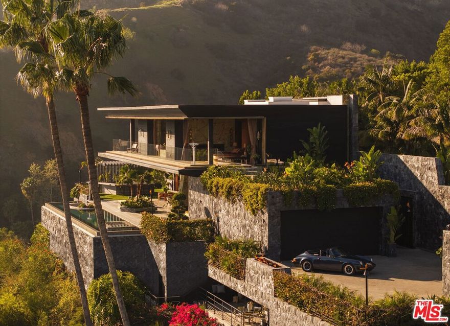 The Disco Volante Estate, an architectural modern paradise meticulously constructed over seven years, utilizing the finest materials and millions just in stonework alone. The only budget was there was no budget; everything had to be the best. Designed with an infusion of styles from Brazil to Asia and inspired by icons from rock 'n' roll to the legendary entertainment of the Sunset Strip. This is a one-of-a-kind home built for the most discerning buyer that wants quality design, function, flow, security, and privacy. Equipped with the latest amenities, and very own private speakeasy nightclub. Situated on a promontory lot with unobstructed front row views of the city from downtown out to the Pacific Ocean. This is a trophy estate you won't find anywhere else in the world or see replicated due to soaring construction costs, architectural design significance and the attention to detail. This unparalleled estate isn't just a home; it's a once-in-a-lifetime experience for you to ink any deal and redefine the art of living.