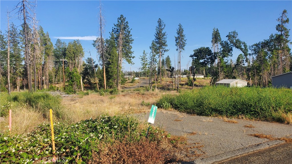AN IDEAL .23-ACRE LOT!! This level property is ready for your dream home with an existing septic system (unknown condition), plus power & water at property just waiting to reconnect to your new home! Beauty surrounds this property as it is close to the disk golf course with paved walking trails and the beautiful green space just a couple lots away with abundant wildlife such as dear and wild turkeys. It offers great development potential, with a partial driveway already in place. The neighborhood boasts a mix of new and established homes, lending it that unique mountain charm. Moreover, the property is conveniently located just about a mile away from a grocery store, various shopping options, the post office, and dining establishments. It also offers a quick and easy commute via Skyway to both Paradise and Chico. For outdoor enthusiasts, this lot is a short drive from recreational opportunities such as fishing, water sports, and adventure in Paradise Lake, DeSabla Lake, Lake Oroville Marina, or the Feather River. The property's inclusion in the Paradise Pines Property Owners Association enhances its appeal & charm, offering access to amenities such as pickleball and bocce ball courts, a children's playground, hiking trails, a swimming pool and spa, a clubhouse with meeting rooms and a library, dual event centers with fully equipped kitchens, and a bar and lounge for special events and community gatherings. This lot represents the opportunity you've been seeking!