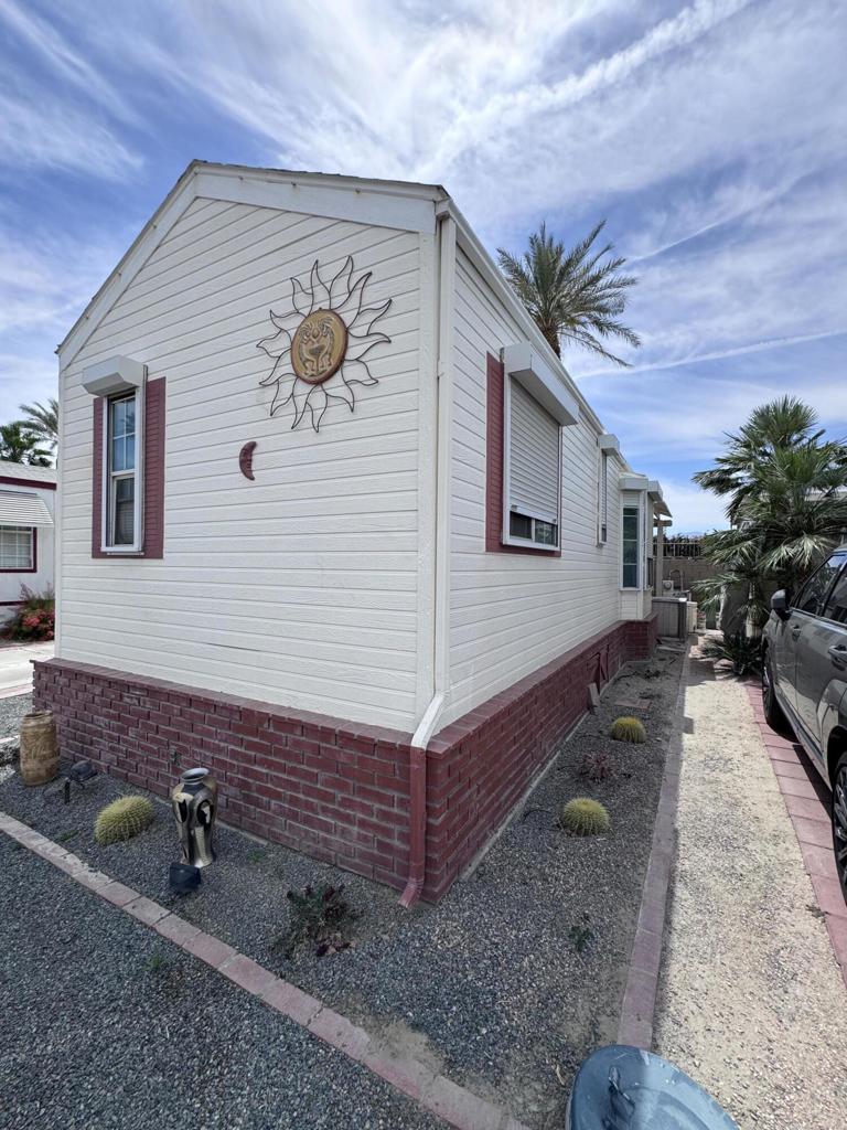 Located in the beautiful Desert Aire resort. Desert Aire is an over 55, pet free, 9 month park. Desert Aire does not permit full time residency. This park is primarily used by snow birds looking to spend the winters in our warmer climate.This 1993 park model is located on the south wall with lots of potential. Just steps from one of the bathrooms / laundry / pool areas. This is a great park model and priced to sell. This park model features high ceilings with an open floor plan and lots of natural light. The kitchen is open and very functional and features a dishwasher. New laminate flooring has been installed throughout the park model for easy maintenance. All of the furniture, bedding and kitchenware is included in the price and is ready to move in.The outside features lots of upgrades with a large storage shed, and huge covered patios. The patios provide lots of privacy and have two large entertaining areas complete with wet bar. You will enjoy entertaining this great space. There is custom red brick skirting around the entire park model.