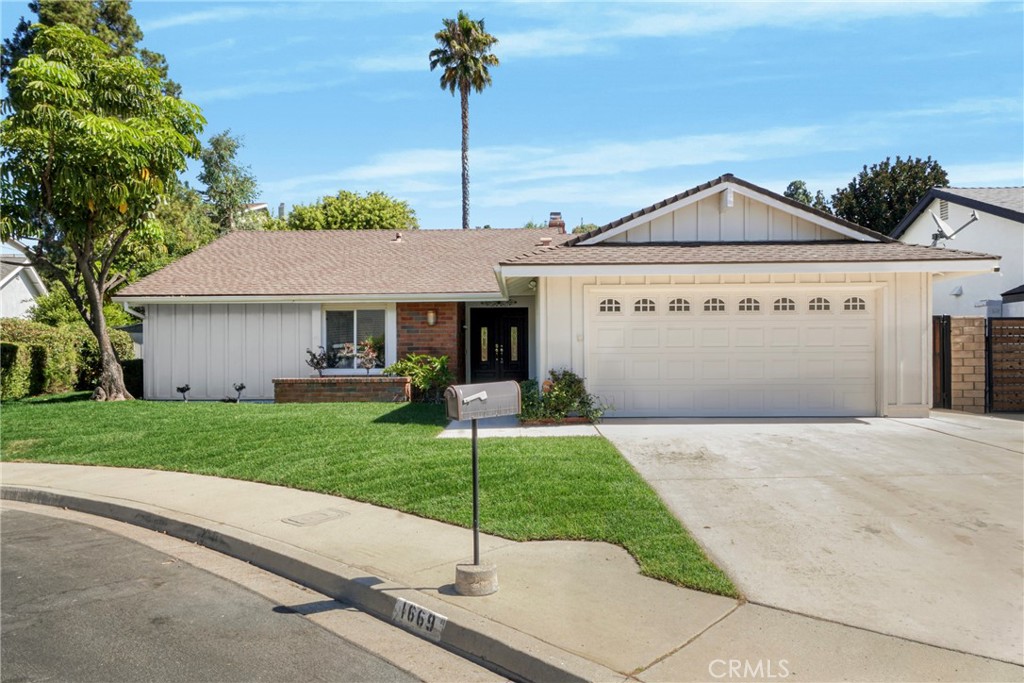Nestled in the tranquil Oakbrook Highlands neighborhood of Thousand Oaks, this newly refreshed single-story home blends comfort and classic California charm. A spacious open-concept layout welcomes you with waterproof Laminated flooring, fresh interior updates, and an inviting flow ideal for both everyday living and entertaining. The heart of the home features a beautifully positioned dual-sided fireplace that enhances both the generous living room and adjacent dining area. The private primary suite offers peaceful separation, complete with its own en-suite bathroom and ample closet space. Step outside to a serene backyard retreat boasting a raised wood deck, putting green, and covered patio—perfect for relaxing or hosting guests in style. Located on a quiet cul-de-sac with excellent proximity to parks, trails, and schools, this move-in-ready gem offers timeless appeal in one of Thousand Oaks’ most desirable communities.