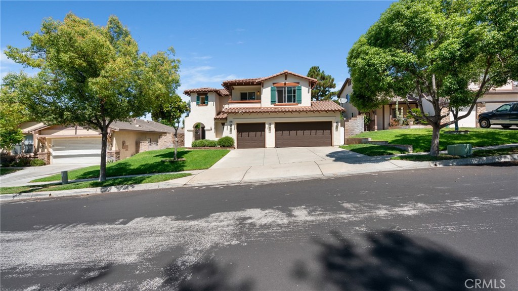 Welcome to your new home in beautiful Chapman Heights — a friendly neighborhood close to shopping, schools, parks, golf, and easy freeway access.
This two-story home offers a bright, open layout with plenty of space to relax and enjoy. The formal living and dining rooms flow into the cozy family room with a fireplace — perfect for gatherings or quiet nights in. The kitchen opens to the family room, making it easy to stay connected while cooking or entertaining. Downstairs also includes a laundry room, a ¾ bathroom, and direct access to the garage.
Upstairs, you’ll find the spacious owner’s suite with a private retreat area and a door to a covered balcony. The ensuite bath includes dual sinks, a soaking tub, and a separate shower. Two additional bedrooms, a full bathroom, and a large bonus room complete the upstairs — perfect for a home office, playroom, gym, or whatever fits your lifestyle.
Step outside to a beautifully landscaped backyard with a covered patio and paved walkways — great for summer BBQs and relaxing evenings.
This lovely home is part of a well-maintained community where the HOA keeps the common areas looking great year-round. Come take a look — it might just be the perfect fit for you!