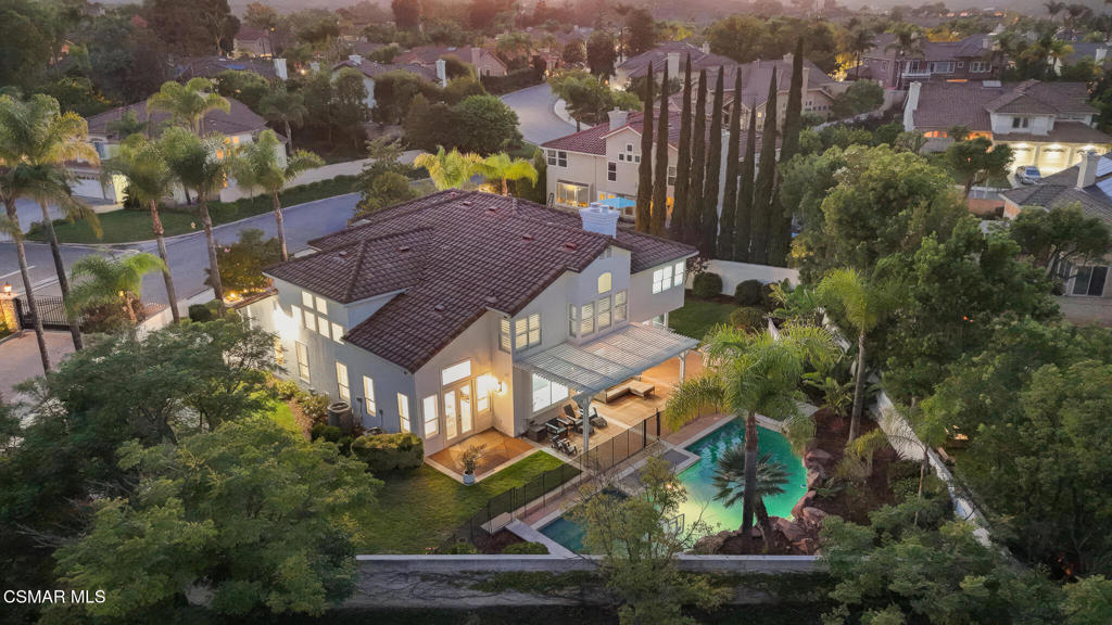 Welcome to 519 Turnbury Street, an elegantly updated residence positioned on a prime corner lot in the guard-gated community of Legacy Estates. This 5-bedroom, 4-bathroom home spans more than 3,800 square feet and has been upgraded throughout with an eye for quality and detail.The interior is bright and inviting, with soaring 20-foot ceilings and an open flow that connects each living space. The formal living and dining rooms are ideal for entertaining, while the family room offers warmth and comfort with its dual-sided fireplace. The interior is bright and inviting, with soaring 20-foot ceilings and an open flow that connects each living space. The formal living and dining rooms are ideal for entertaining, while the family room offers warmth and comfort with its dual-sided fireplace. A bedroom and full bathroom on the main floor provide flexibility for guests, an office, or playroom. The adjoining kitchen is the centerpiece of the home, showcasing custom cabinetry, quartz countertops, a striking backsplash, and a large center island.The adjoining kitchen is the centerpiece of the home, showcasing custom cabinetry, quartz countertops, a striking backsplash, and a large center island. A full suite of stainless steel appliances includes an oversized side-by-side refrigerator and freezer along with an 8-burner range. Thoughtful touches such as a walk-in pantry, coffee station, Lazy Susan, and spice rack make everyday living effortless. A bay window frames picturesque views of the backyard and sparkling pool, filling the space with natural light.Upstairs, the primary suite provides a private retreat with its own cozy fireplace, two spacious walk-in closets, and a luxurious bathroom featuring dual vanities, a makeup station, freestanding tub, and custom walk-in shower. Three additional bedrooms and remodeled bathrooms complete the second floor. Additional upgrades include newer tile and carpet, iron and glass entry doors, dual-pane Milgard windows, fresh interior and exterior paint, two newer AC units, and updated lighting and hardware.Outdoors, more than 13,400 square feet of flat, landscaped grounds create the feel of a private resort. A newly refinished Pebble Sheen pool and spa are paired with a built-in BBQ and refrigerator, gazebo lounge, fruit trees, and outdoor lighting, perfect for both quiet evenings and lively gatherings. The 4-car garage with drive-through access, abundant storage, and a driveway with parking for 8+ vehicles provides unmatched convenience.Located minutes from Wood Ranch Country Club, tennis courts, hiking trails, and award-winning schools, 519 Turnbury Street offers thoughtful upgrades, generous living space, and an exceptional setting within one of the area's most desirable communities.