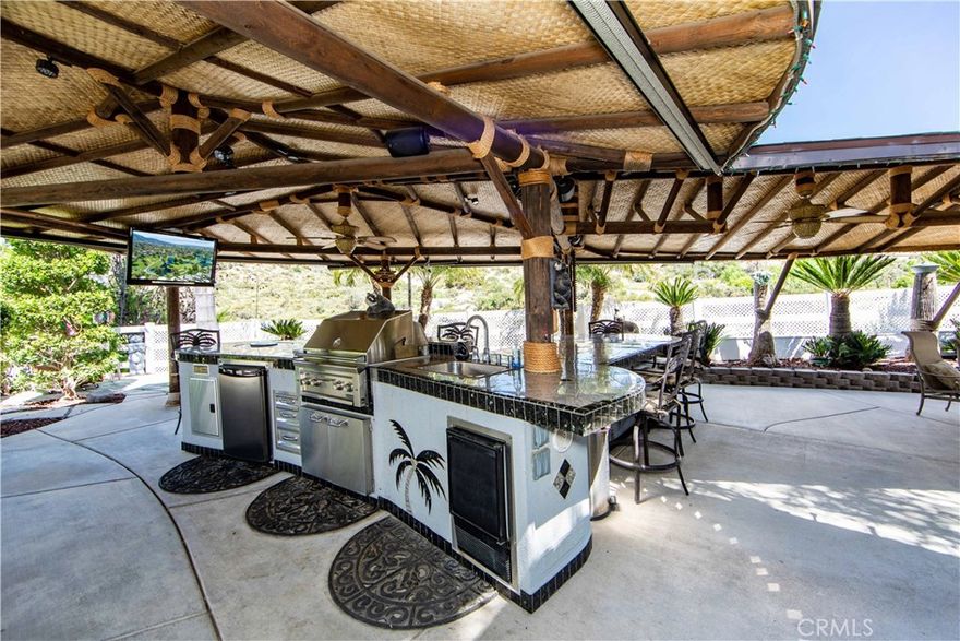 Entertain, Entertain Entertain, this property has a ginormous custom built Island with full cover and plenty of seating with two different areas for guests. You will love the finishing touches throughout the site. They thought of everything while they have been living on the property for years. The extra considerations with 2 parking areas for golf carts, Sego Palms all over and set on sprinklers for a low maintenance but beautiful lot. A few add-ons they added to the site: Built-in BBQ, Washer & Dryer, 2 mini refrigerators, stereo system, outdoor TV, water softener, even artificial turf. Included in Rancho California RV Resort is a 14 hole Executive Golf Course that is free for owners, 5 Pools and Jacuzzi areas, Tennis Courts, Pickle Ball Courts, Laundry Rooms, Dog Park, Horse Shoe Lawn, Club House, Hiking Trails, and Restaurant all inside Gated Community that is Guarded 24/7. You can live here or rent your space. Peace and quiet serenity all just 25 minutes from Temecula Wine Country. No age restrictions. Come on over and check this hidden gem of a place out... Financing Available...