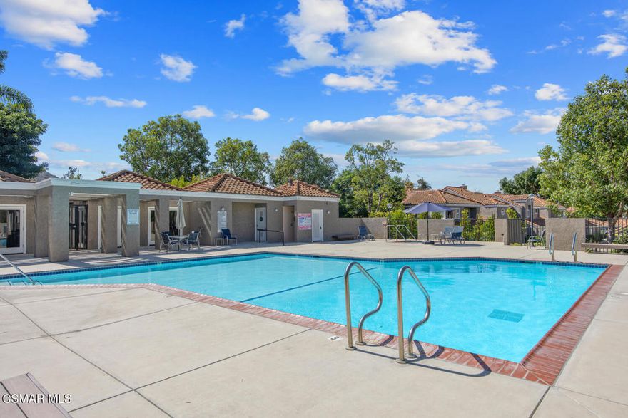 Enchanting single-story townhouse nestled in the sought-after gated community of Miramonte in Camarillo Springs. This delightful 2-bedroom, 2-bathroom lower end unit offers an inviting open floor plan, complemented by a cozy fireplace that serves as the heart of the home.Step into a kitchen equipped with recessed lighting, a new stove, tile countertops, and a convenient breakfast bar, perfect for casual dining. The adjoining dining area, illuminated by a ceiling fan, flows seamlessly into the living space. The new wood flooring in the secondary bedroom offers both durability and style.The primary bedroom is a serene retreat featuring a sliding door that opens to a private backyard patio which backs to a community pool, ensuring relaxation is just steps away. The ensuite bath with dual sinks and shower completes this master sanctuary.Additional highlights include tile flooring & wood blinds throughout, an indoor laundry room, a 2-car attached garage, and community amenities that include a large pool, spa, fitness center, clubhouse, and nearby golf course. With the Santa Monica Mountains as your backdrop and easy freeway access, this townhouse in Camarillo is a perfect blend of comfort, convenience, and charm.