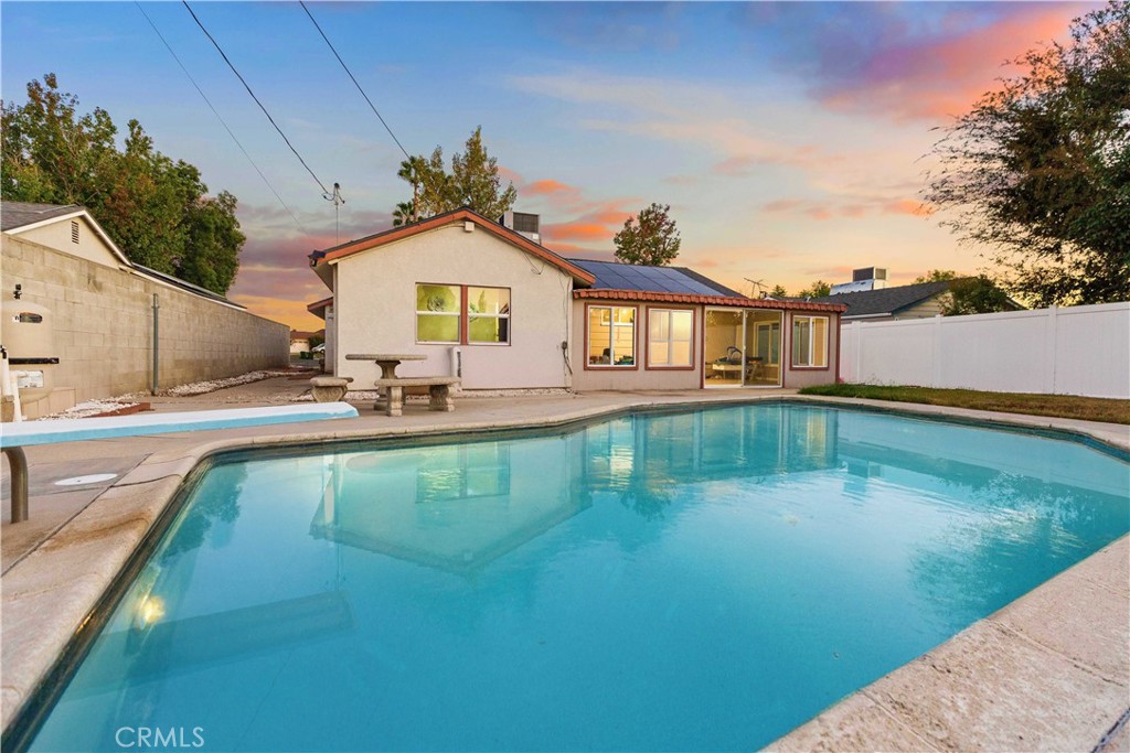 This beautifully remodeled Granada Hills home blends comfort, style, and functionality with thoughtful upgrades throughout. Featuring a new roof, solar panels, and a new HVAC system, it offers modern efficiency and lasting value.
The updated kitchen showcases stainless steel appliances, sleek finishes, and an open layout that connects seamlessly to the dining and living areas. Once outside a private backyard retreat with a Pebble-Tec pool and enclosed patio, perfect for entertaining or relaxing. Both bathrooms have been tastefully updated, including one with direct outdoor access, ideal for poolside convenience.
Additional highlights include a two-car attached garage, spacious driveway, and beautifully updated flooring throughout. Conveniently located near top-rated schools, shopping, and major freeways, this home offers the perfect balance of modern upgrades and prime location. Experience the best of Granada Hills living, move-in ready and designed to impress.