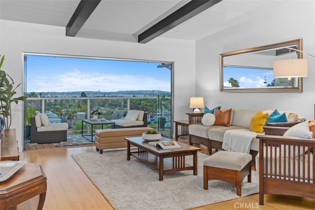 Experience the perfect blend of coastal charm and modern comfort in this Pacific Beach home. Tucked into a peaceful cul-de-sac, it offers sweeping south-facing views towards downtown, the airport, and the bay from both levels. From the moment you pass through the private gate, the distinctive mini pool in the front courtyard sets a tone of relaxation and style. Inside, open and functional spaces flow naturally, creating an effortless balance of form and function. Recent homeowner investments include a new roof (2023), central A/C, upgraded insulation, a new water heater, and a 40A Level II electric car charger in the garage — delivering comfort, efficiency, and modern convenience. Additional features include built-in kitchen appliances with a microwave/convection oven and vent hood above the range/oven. Smart-home and security upgrades add peace of mind and everyday convenience: four security cameras, wireless control of lighting, garage, pool, and spa, six integrated Nest fire + carbon monoxide alarms, and a fully enclosed fence locked from the inside. Location highlights include an 11-minute drive to UCSD’s La Jolla campus, biotech hub, and UTC; 15 minutes to San Diego International Airport; Rose Creek bike trail access within a short ride; and proximity to Mission Bay and the Balboa Trolley Station. Whether hosting gatherings, enjoying sunset views, or simply appreciating the peaceful setting, this home is designed for the ultimate in coastal living. A true entertainer’s dream and a serene retreat all in one — offering the lifestyle buyers seek on the Southern California coast.