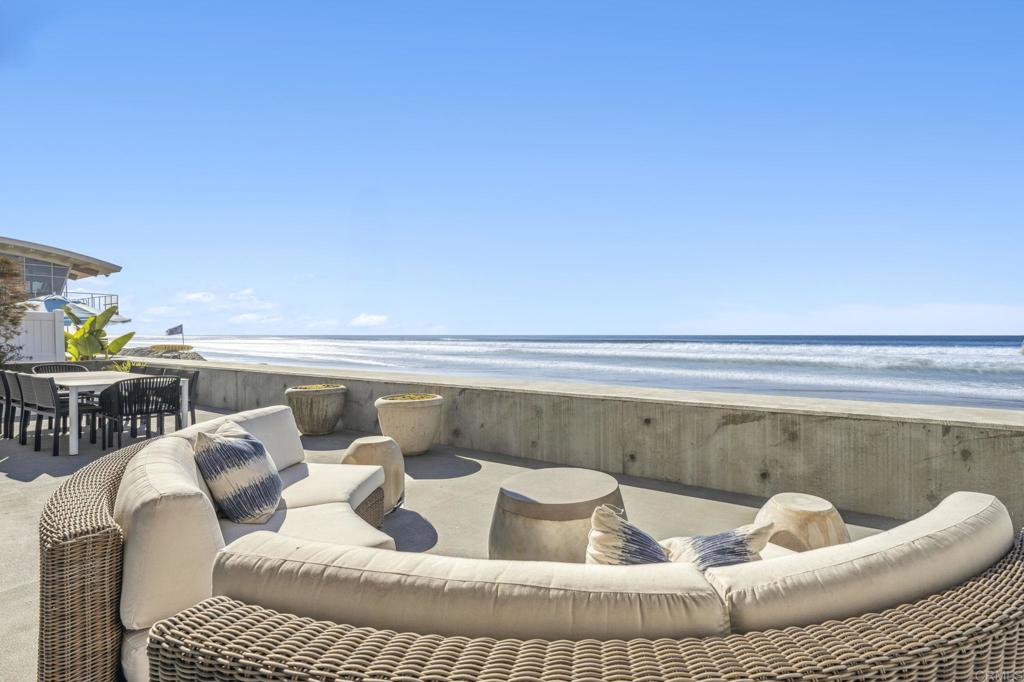 Get ready to live the ultimate coastal dream in this jaw-dropping, ultra-rare luxury oceanfront home for sale in Del Mar—one of the world’s premier destinations, thanks to its perfect year-round weather and iconic West Coast charm. This isn’t just a home—it’s a front-row seat to the Pacific Ocean’s mesmerizing beauty, with 60 feet of prime beachfront and unobstructed, panoramic views that will leave you speechless. Picture yourself waking up to the sound of crashing waves, dolphins dancing in the surf, and the salty breeze kissing your skin—this is beachfront living at its absolute finest. Whether you're searching for a California beachfront property, a West Coast luxury retreat, or an exclusive waterfront estate, this home delivers. Nestled on an expansive 11,614-square-foot lot, this Southern California oceanfront estate boasts 6,000 square feet of seamless indoor/outdoor living space and is a haven of luxury and serenity. With a cutting-edge 8-foot sea wall and the Pacific Ocean as your backyard, you’re not just buying a home—you’re claiming a lifestyle. Step onto the massive 1,000-square-foot deck, perfect for hosting unforgettable sunset soirees or simply soaking in the coastal magic of this Pacific Ocean paradise. Every room is a window to the sea, offering breathtaking ocean views that make every day feel like a vacation. The crown jewel? The primary suite, where you’ll drift off to sleep with the soothing lullaby of waves and wake up to direct balcony access with vistas that stretch to the horizon. With six spacious bedrooms, six bathrooms, and private guest or staff quarters with their own entrance, this luxury beach house is built for grand living and effortless entertaining. Plus, parking for 10 vehicles—including an oversized two-car garage and a separate single-car garage—makes this a rare find among beachfront properties in California. This estate is steeped in glamour, having welcomed Hollywood icons like Jimmy Durante, Lucille Ball, Desi Arnaz, and Burt Bacharach to its pristine shores. Now, it’s your turn to make history. Imagine sipping your morning coffee while watching dolphins play, hosting starlit gatherings on your private deck, or strolling to Del Mar’s world-class restaurants and coastal boutiques just steps away. This is more than a home—it’s a once-in-a-lifetime opportunity to own a slice of paradise in one of the most coveted beachfront locations in the world. Whether you’re searching for a waterfront property for sale, a Pacific Coast luxury retreat, or a California oceanview home, this Del Mar masterpiece offers unmatched elegance, location, and lifestyle. Don’t let this dream slip away—your coastal sanctuary awaits.