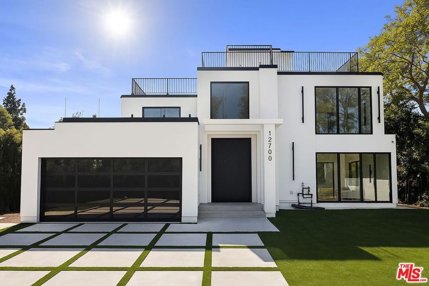 Stunning Newly finished Construction 4 bed/4.5 bath 2-Story Custom Contemporary with pool and large rooftop patio overlooking golf course and Getty Center views! Totally enclosed front yard with auto driveway gate, this home is designed with all the latest designer finishes and filled with incredible natural lighting. Double-sized front door opens to living room with large floor-to-ceiling windows overlooking front yard greenery.  Family room with stacked multi-panel door system opening to spacious backyard patio, newly installed pool and yard with built-in fire pit and seating, ideal for entertaining with the perfect indoor/outdoor flow. All-new Modern kitchen with tiled walls, floating shelves, high-end stainless steel appliances including Thermador six burner range with griddle and pot filler, island with breakfast bar and quartz countertops. 1 bedroom with ensuite bath downstairs and 3 additional bedrooms upstairs including beautiful front-facing primary suite with stacked panel glass door to spacious balcony with spectacular golf course views. Spa-like primary bathroom with custom tile and quartz finishes including separate spa bathtub and shower and double sinks. Stairway continues to over-sized rooftop deck with spectacular panoramic city, treetop, golf course and mountain views.  Prime location just a few blocks to Brentwood's San Vicente restaurants and retail, Santa Monica's Montana Avenue retail and restaurants and beach.  Available immediately!