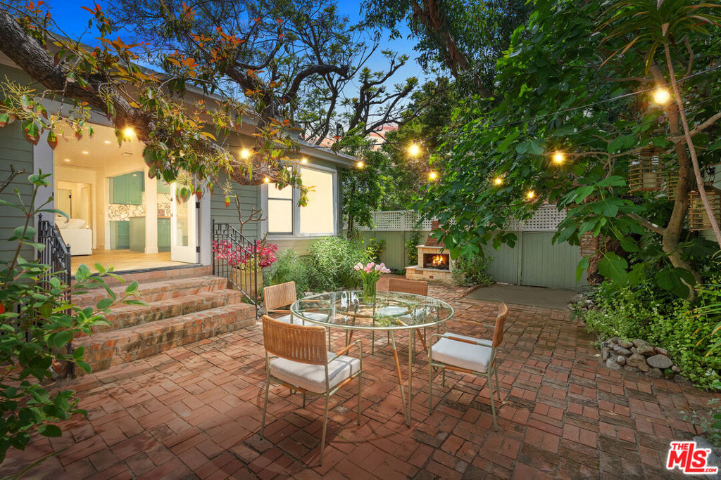 FULLY FURNISHED AVAILABLE AUGUST 1ST! Welcome to your own private sanctuary in the heart of West Hollywood! This meticulously remodeled French cottage is a true gem, boasting elegance and charm at every turn. With 2 bedrooms and 2 bathrooms, this home offers the perfect blend of intimacy and functionality. Step inside and prepare to be amazed by the top-of-the-line appliances that adorn the gourmet kitchen. Equipped with a Sub-Zero refrigerator, a Wolf range, Waterworks finishes, and an oversized Walnut Wood Island, this culinary haven is sure to delight even the most discerning chefs. The herringbone oak flooring gracefully flows throughout the main living spaces, exuding a sense of timeless beauty. As you make your way through the house, you'll be enveloped by lush greenery from every window, creating a tranquil oasis. The living room beckons you to unwind and relax, with its cozy atmosphere and a seamless connection to the outdoors. Open the French doors and find yourself in the serene courtyard, where a captivating firepit awaits with an outdoor dining area that invites you to dine al fresco under the starlit sky, surrounded by the enchanting ambiance of your private garden. This extraordinary property doesn't stop there. A detached bonus studio space offers endless possibilities of a guest suite, a home office, or even a personal gym. Prepare to be enchanted by the unparalleled beauty and exquisite attention to detail that defines this French cottage. Walking distance to all Melrose Shopping, Restaurants, and Cafes such as Craig's, Bravo Toast, and Maxfield's. Welcome home to a world of refined elegance and tranquil living!