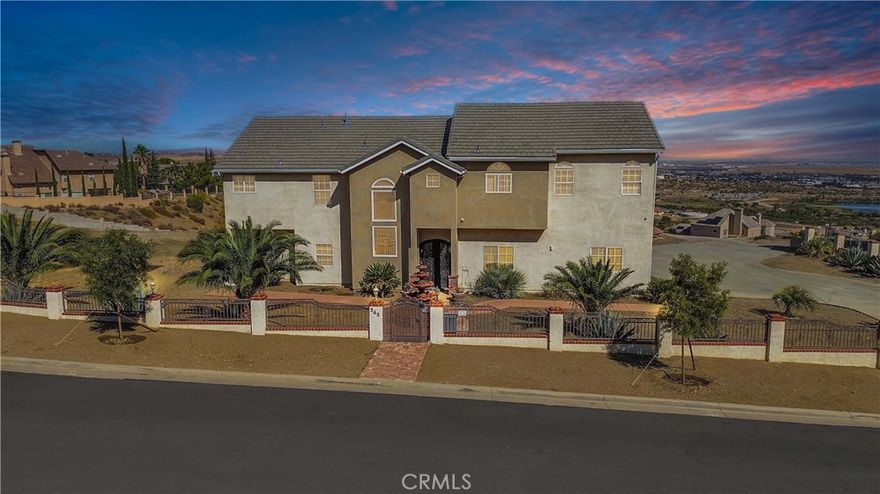 Welcome To The “Jewel Of The Hill.” Discover This Exceptional 5-Bedroom Plus Office (Possible 6th Bedroom), 3.5-Bath Home Spanning Over 3,200 Sq. Ft. Of Refined Living Space With A Spacious 3-Car Garage. Step Inside To Find Multiple Fireplaces Creating A Warm And Inviting Ambiance Throughout, Complemented By An Elevator For Effortless Access. Enjoy An Open-Concept Kitchen With Butler Pantry And Breathtaking Panoramic Views Of The Surrounding Mountains, City Lights, And Lake, Perfectly Situated In One Of Palmdale’s Most Desirable Hillside Communities. Designed For Both Elegance And Comfort, His and Her Large Closets,2 Jacuzzi Tubs, Fully Gated Property Offers Unparalleled Privacy, Abundant Storage, And Stunning Views That Truly Elevate The Living Experience. Don’t Miss The Opportunity To Call This Remarkable Home Your Own.