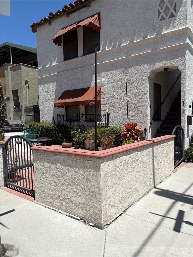 This 5359 E. 1st Street is a Beautiful Spanish Duplex just steps a way to the Bay and the Ocean! Gorgeous hardwood floors. French mullioned windows in living rooms and dining rooms with crown moldings and sculpted archways. The downstairs unit is a large 2-bedroom 1 bath. Large living room with great lightings and windows. Formal dining room and breakfast nooks. Inside Laundry room. All upgraded kitchen with new plumbing, new pull-out drawers. and all new appliances. Utility room. Newly painted, split heating/air conditioning new luxury vinyl flooring in kitchen, dinette. Small garage for storage. Very nice larger corner lot that brings tons of light in this a south facing exposure unit. This excellent location in the best part of Belmont Shore is also just a short walk to tons of trendy eateries, boutiques and brand name retail shops.