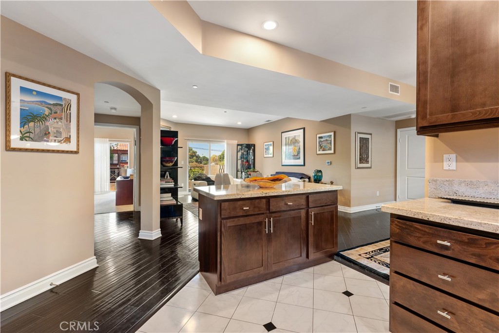 Stunning, immaculate, top floor residence in the coveted Lumiere Condominiums. A modern architecture building, a quiet oasis, yet close to everything in the heart of Studio City. One of the largest open floor plans in the building, this warm and bright home inspires a feeling of serenity and space leaving no detail behind. Morning, day, and evening light flood the unit from large windows, glass, and skylights. Modern features with timeless charm: engineered wood floors, stainless steel appliances, granite countertops, plantation shutters, new fixtures, spa-like master bath, motorized drapes, recessed LED lighting and more. This home features the highest and greatest capacity storage available in building with efficiencies throughout, including a large upgraded walk-in mainbedroom closet, custom designed pull outs, shelving, and drawers allow you to store more and live clutter free. Top of the line LG Washer/Dryer in unit. Huge main bedroom. Large second bedroom. A private terrace balcony, and an open outdoor furnished zen garden courtyard provide great places to unwind and relax in beauty at the end of a long day. Modern workout room featuring newer state-of-the art equipment and plenty of room to exercise. Secure and clean subterranean garage, with two dedicated side by side parking spaces (a premium feature vs. tandem). Security systems and features throughout the building. HOA fee includes hot water,trash service, gym usage, upgraded entry security system, underground parking, and earthquake insurance. Pride of ownership not only within the unit, but throughout the building, where the association has spent countless hours caring for the beauty and function of the building, including attention to details in the infrastructure for quality and efficiency. Newer building and healthy HOA. This is truly a spectacular one-of-a-kind home.