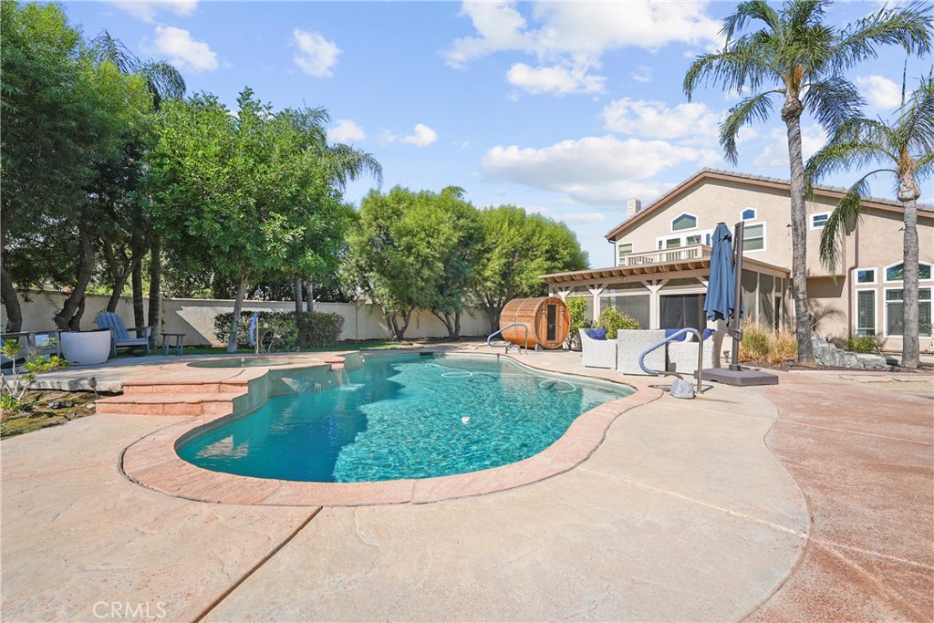 Welcome to this beautifully designed 5-bedroom, 3-bathroom home offering 2,467 sq ft of living space. Upon entry, you're greeted by soaring high ceilings and a formal living and dining area that set the tone for spacious, elegant living. The layout includes a full bedroom and bathroom downstairs — ideal for guests or multi-generational needs.
Step outside to a backyard built for relaxation and entertainment, featuring a sparkling pool, spa, and private sauna. RV parking and a 3-car garage provide ample space, while paid-off solar panels offer long-term energy savings. With no Mello-Roos and a location close to schools, parks, and shopping, this home delivers comfort, convenience, and lifestyle in one complete package