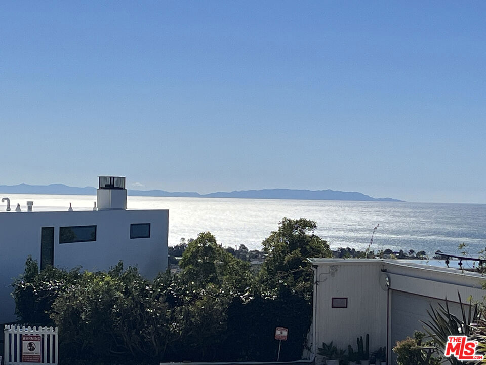 Presenting an incredible opportunity to build a dream home on a large, unique, flat buildable pad in beloved Pacific Palisades with uninterrupted panoramic views of the ocean, Catalina Island, coastline, beaches, city lights, and Downtown LA. This rare, desirable parcel is sited on Chautauqua just above the Palisades Village shopping center, set to reopen in early 2026. World-famous beaches, hiking trails, the beauty of Malibu, and all the best of the Westside are just moments away. With great effort taken by city departments to improve the resilience of infrastructure and to promote fire-resistant construction in the area, a restored Pacific Palisades will be better than ever. According to recent reporting by LAist, LAUSD has approved a $604 million plan to rebuild all three nearby LA Unified schools with estimated completion by the end of 2028 and some campuses opening as early as 2026. Rebuilding efforts continue to be accelerated, reflecting the appetite of residents and local officials to rebuild and restore Pacific Palisades to the close-knit community so many have cherished and loved to call home.