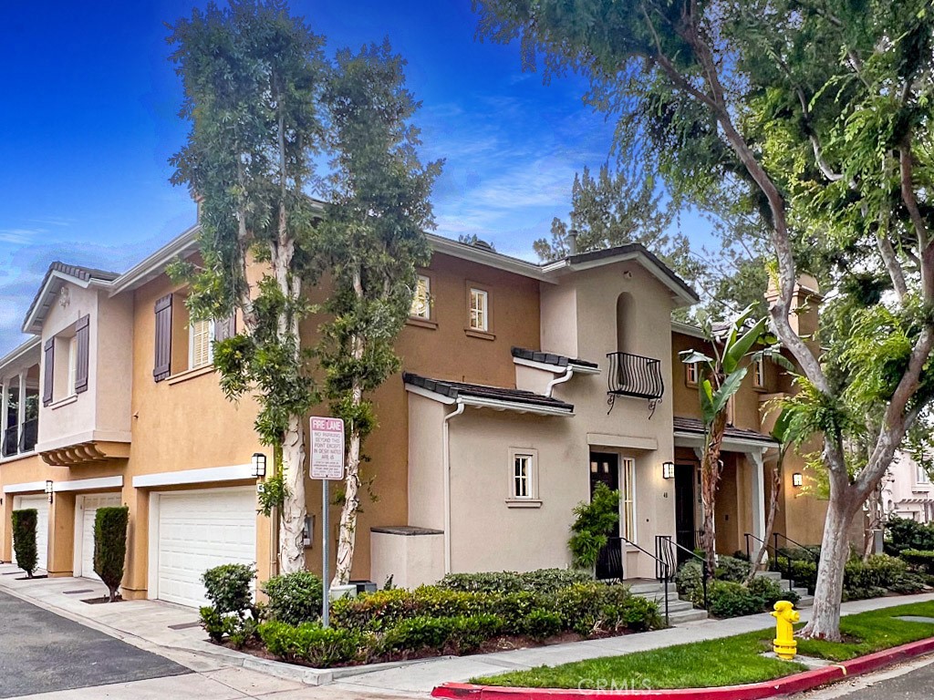 A bright and open concept home is ready for move-in! It is ideally located in the Northpark Square community in Irvine! The home has an open floor plan with all living headquarters on the second floor. Conveniently built-in is an automatic stair lift to take one to the second level should it be necessary (attached chair is removed and can be reattached upon request). The large kitchen overlooks the living room with cozy fireplace and the dining area is next to the private spacious balcony. Kitchen has a built-in breakfast bar with additional seating, plentiful maple cabinets, a new stainless steal sink, and a walk-in corner pantry. Kitchen includes gas range, over the range microwave, stainless steel dishwasher, and a stainless steal refrigerator. Immediately next to the kitchen is a separate laundry room complete with a washer and dryer, and upper cabinets for storage. Bedrooms and closet have new carpet. Master suite has a sizable walk-in closet, ceiling fan, dual sinks, walk-in shower, and a privacy toilet door with lower cabinets for extra storage. The secondary bedroom has an abundance of bright light with two fixed windows, mirrored closet doors, and sliding doors that connects to the private expansive balcony. The home has recessed lighting, wood flooring in the main living areas, tile flooring in the kitchen and bathrooms, and new paint throughout. 2-car garage with direct access is below the home. The Northpark Square Association provides luscious landscaping, picnic areas and field, basketball court, Junior Olympic size swimming pool, spa, gas BBQ grills, and parks. Many options for shopping and dining nearby including the Irvine/Tustin Marketplace. Close to the 5 Freeway and the 261 Toll-way. Close to award winning schools in the Tustin Unified School District and walking distance from Beckman High. Come see and make this place your home!