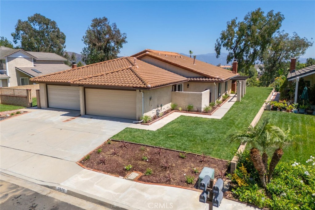 Welcome to this beautifully updated three-bedroom, two-bathroom home that combines modern upgrades with generous space. The open and inviting floor plan is bathed in natural light, creating a warm, welcoming ambiance throughout. Enjoy new flooring, a remodeled kitchen featuring white cabinetry, sleek new countertops, and brand-new stainless steel appliances. The home also includes new energy-efficient dual-pane windows and sliding glass doors. The hallway bathroom has been thoughtfully remodeled with new flooring, double vanity, and custom tiled enclosure. The primary bedroom offers a large closet and a stylishly updated bathroom with new flooring, double vanity, and a spacious shower. You'll appreciate the convenience of the two-car garage. Indoor laundry facilities and a large, private backyard with breath taking views—ideal for entertaining or unwinding. Don't miss out on the chance to make this exceptional home yours!
