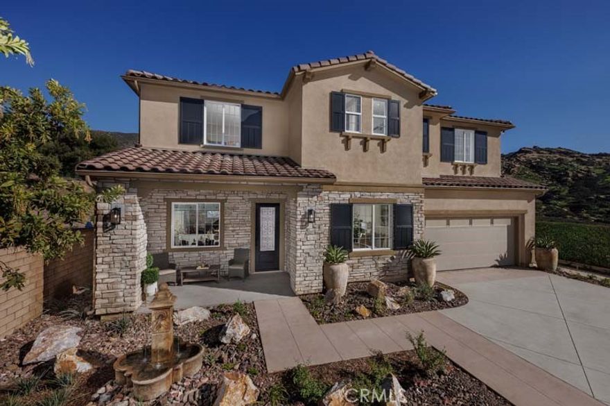 Your Move-In Ready Luxury Home Awaits in Pacific Royal Oaks.



Discover Plan 3 at Pacific Royal Oaks, one of only 24 exclusive homes in this serene gated community. Situated on a generous 24,035 sq. ft. lot, this stunning new luxury home offers 4,390 sq. ft. of beautifully crafted living space, featuring 5 bedrooms and 4.5 bathrooms.



Designed with both function and elegance in mind, the home features a junior suite with a private entrance, kitchenette, and en-suite bath—ideal for multi-generational living or long-term guests. The main floor includes a large flex room with French doors, perfect for a home office or den, and a stunning great room anchored by a double-sided fireplace and an extended slider that opens to the backyard, blending indoor and outdoor living.

The chef-inspired kitchen is fully upgraded with premium Dacor appliances, a built-in refrigerator, an extended island, an undercounter wine and beverage chiller, upscale cabinetry with glass uppers, and enhanced LED lighting throughout. Beautiful upgraded flooring flows throughout the home, adding warmth and sophistication to the open floor plan.



Additional features include a 3-car tandem garage, a loft, and a thoughtfully zoned layout ready to accommodate your dream backyard—whether you envision a pool, outdoor kitchen, or custom entertaining area.



Enjoy convenient access to the 118 Freeway, The Vineyards at Porter Ranch, and top-rated schools, along with nearby scenic hiking trails like Hummingbird Trail. With no Mello-Roos fees and immediate move-in availability, this exceptional home is ready for you to make it your own.



*Photos shown are of the Plan 3 model home and are for representation purposes only. Actual features, finishes, and layout may vary.