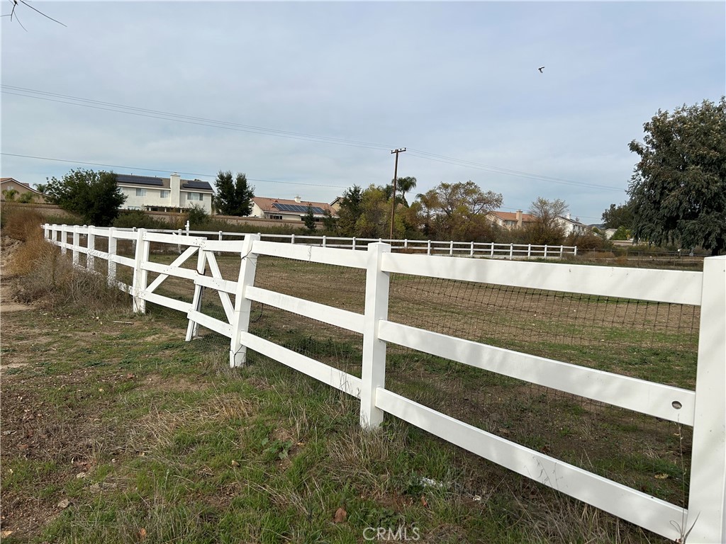 Popular location in "Old Town" Murrieta Area. Nice Corner lot in peaceful setting with 3 rail fencing. 2 separate parcels that are being sold together. Utilities are in the street. Manufactured homes are ok. No HOA, just City of Murrieta development requirements .