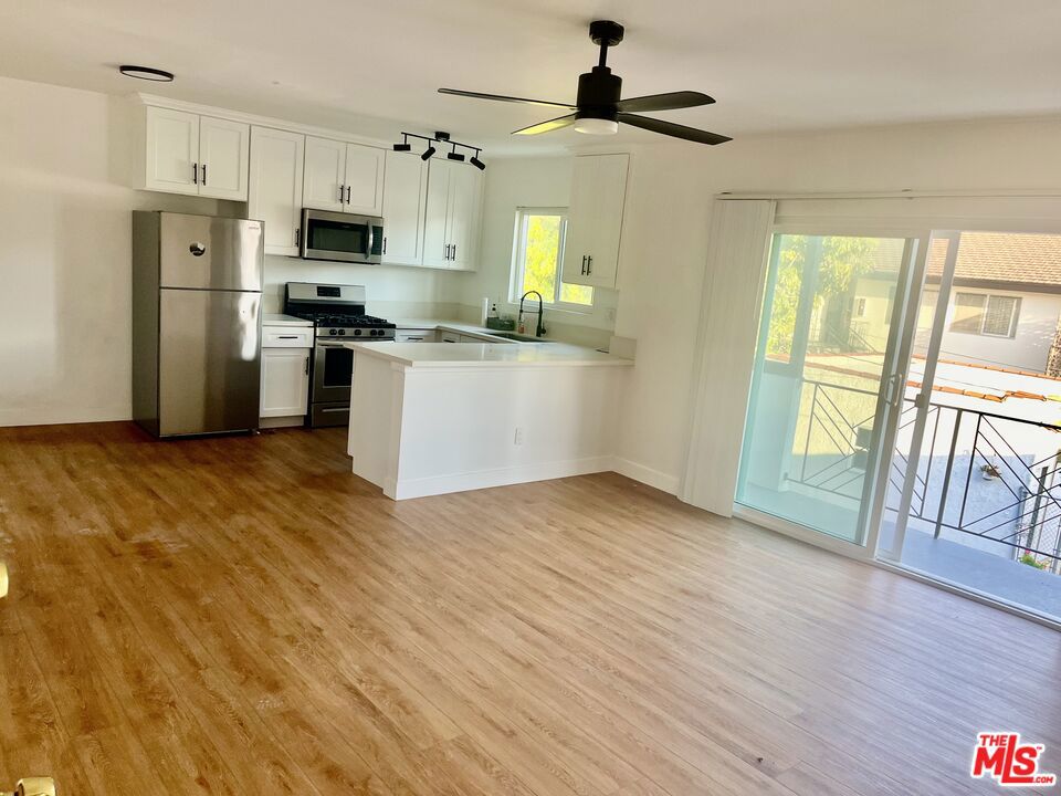 Fully remodeled and spacious upper level apartment with 2 Bedrooms and 1.5 Bathrooms in an amazing Culver City location. Walking distance to Downtown Culver City plus convenient access to the 405 and the 10 freeways. Open concept kitchen overlooking the living room and sliding glass door to a private outdoor balcony with great skyline views. Each bedroom has its own wall mounted AC/heating unit plus ample closet and cabinet space. Enjoy your privacy with no apartment above. Includes high ceilings, 3 ceiling fans, a 3rd heating/AC wall unit in living room, vertical blinds on all windows, and a storage locker. 1 private parking spot available for additional $100/month. Street parking with permits also available. Shared washer/dryer in building. Minimum 1 year lease. Utilities not included. Available starting November 1st only.