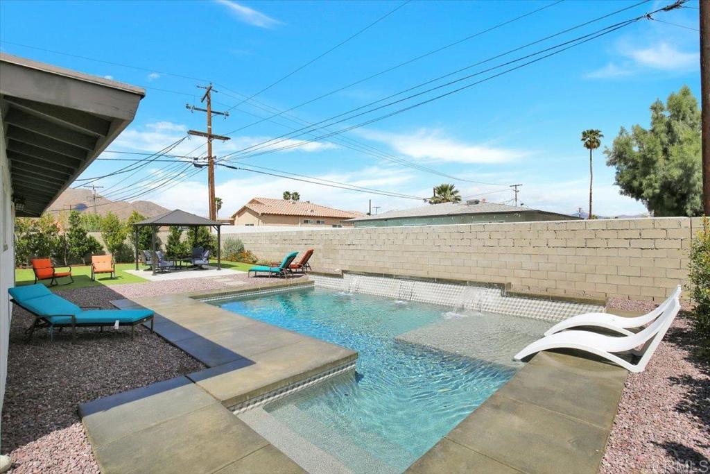 3 bed, 2 bath updated home with a spacious front yard and backyard that includes a patio area, plants on a sprinkler system, and no land lease! New water heater installed in January 2025. Currently under the 20% cap rate with the city to qualify for short-term rental license.