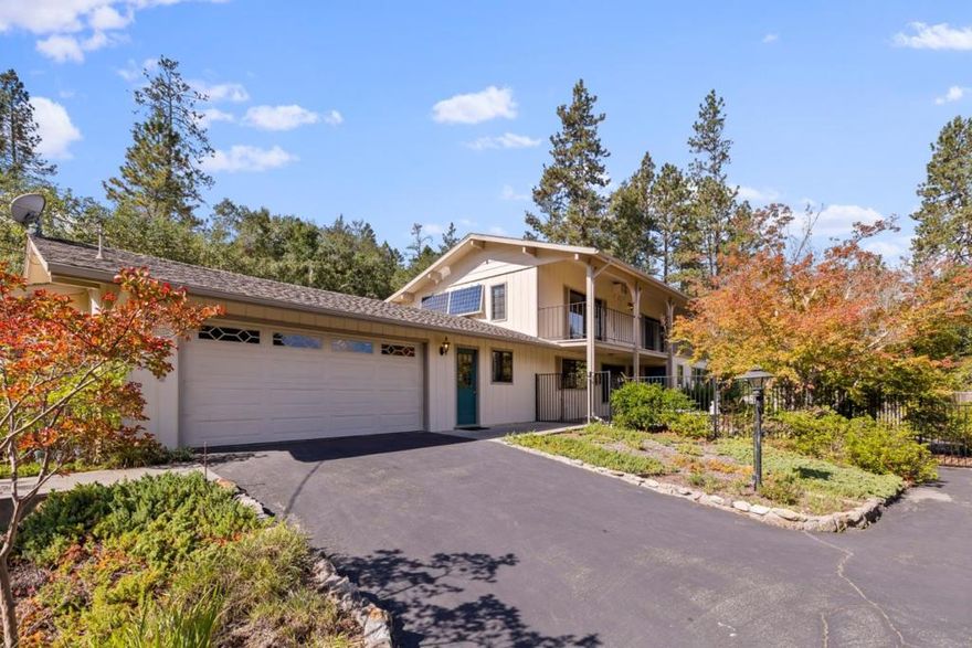 Tucked amidst mature landscaping and tastefully manicured trees on nearly three-quarters of an acre of sunny usable land, 7415 Hihn Road embodies the Ben Lomond lifestyle: Peaceful, practical, and deeply connected to nature. This 3-bedroom, 2-bath home spans 1,934 square feet with solar power, central heating, and a cozy fireplace for cool mountain evenings. The third bedroom, once a finished office and workspace, is ideal for a creative studio or guest suite. Outside, the fenced yard overflows with lush vegetation and fertile soil, the ideal haven for gardening, fruit trees, or a small flock of hens with a fully-enclosed orchard area in front, plus a terraced back section of the property that exists beyond the fenced areas at the ready to explore the possibility of adding an ADU or possibly even a lot split if Environmental Health approves minimum 10,000 SF minimum standards at some time in the future. This is at the quiet end of Hihn where the topography levels out and neighbors walk their dogs and say hello. It's the kind of place where you can live simply, breathe deeply, and still be moments from town, local markets, and San Lorenzo Valley's beloved local Community Theater.