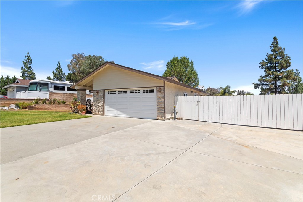 Incredible opportunity! Upgraded single story with RV parking. Perfect for the weekend warriors with RVs, trailers, boat, toy haulers, etc. Beautiful curb appeal with stacked stone facade, towering trees, and enclosed front patio, new roof and gas fireplace. Open concept gives this home a large feeling with separate living/family room. 3 spacious bedrooms and 2 bathrooms. Open kitchen with stainless steel range and microwave. New double paned windows and shutters. Community pool and tennis courts. Minutes from OC! Agents, show this home to your motivated buyers, and let’s open escrow. Home is sold "AS IS".