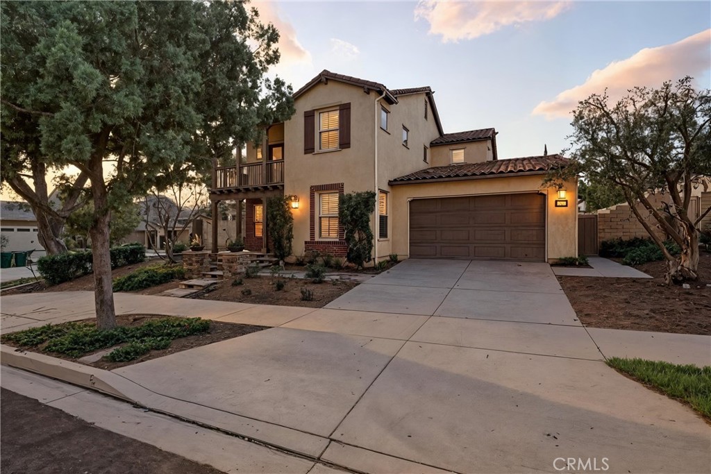 Welcome to 147 Yellow Daisy, a stunning showcase of modern elegance on a premier corner lot in Irvine’s prestigious Great Park community. This beautiful 4-bedroom plus office, 4.5-bath residence spans 2,689 sq. ft. and sits on one of the largest lots in Great Park, approximately 6,820 square feet, offering exceptional space, privacy, and functionality. Step inside to discover a bright, open floor plan filled with natural light. The spacious great room, highlighted by disappearing glass doors, extends effortlessly to the serene backyard, perfect for al fresco dining, lounging, or year-round entertaining. The private yard is enhanced by tropical and exotic fruit trees including mango, dragonfruit, lychee, guava, and Fuji apple. A rare and delightful touch to outdoor living. At the heart of the home, the gourmet kitchen is both stylish and functional, featuring a built-in refrigerator with custom cabinet panels, a sleek under-counter beverage cooler, quartz countertops, premium stainless steel appliances, and a large center island. Flowing seamlessly into the family room. Designed with versatility in mind, the main level offers a junior master suite—perfect for guests or multigenerational living—alongside a dedicated home office. Upstairs, the luxurious primary suite serves as a true retreat with dual vanities, an oversized walk-in closet, a walk-in shower, and a spa-inspired jacuzzi soaking tub. Each additional bedroom includes its own en-suite bathroom, providing comfort and privacy for all. This home also includes significant energy-efficient upgrades: 34 oversized, fully paid solar panels valued at $40,000, producing 14 kWh annually—enough to cover the household’s total energy consumption plus charging for two EVs. With estimated savings of approximately $6,000 per year, you may never have to pay an electricity bill again. The garage is equipped with a NEMA 14-50 outlet for EV charging, compatible with Tesla and all major EV brands. A three-car garage with epoxy-coated floors adds both functionality and durability. Beyond the residence, Great Park’s vibrant community lifestyle awaits. Enjoy resort-style amenities including sparkling pools, lush parks, playgrounds, sports courts, and miles of scenic trails. With award-winning Irvine schools, convenient shopping, and engaging neighborhood events, 147 Yellow Daisy is more than just a home—it’s the perfect blend of comfort, luxury, efficiency, and community.