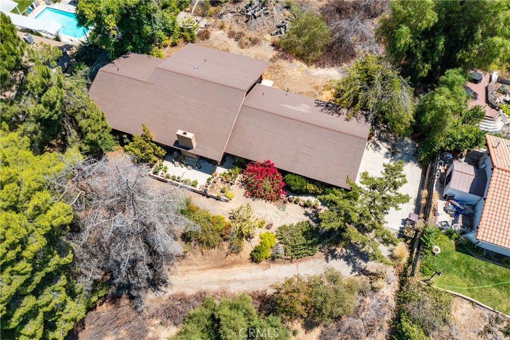 This charming property is a diamond in the rough, offering a fantastic opportunity for those looking to renovate and customize your dream home. The property is located in Hemet's desirable Sprague Heights Community on .53/acres with awesome views of the valley below. In addition, this spacious layout has ample square footage which includes 4 bedrooms, 2 bathrooms, a huge living room with a wood burning fireplace, a separate dining room and a family room. With some landscape maintenance, flooring, paint and updates, this can be a beautiful gem! No HOA and a low tax base. Schedule a showing soon.