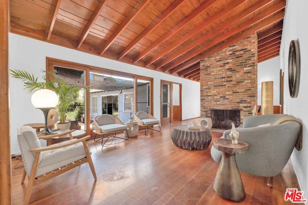Welcome to 17439 Haynes St, a charming piece of history nestled in the iconic Lake Balboa area! This beautifully preserved 1,963 square foot single-family home, built in 1954, features 3 bedrooms and 2.0 bathrooms, offering ample space for comfortable living. The home boasts timeless character with its warm wooden ceilings, hardwood floors, and 2 cozy antique brick fireplaces that anchor the spacious living area. Large windows and sliding glass doors flood the home with natural light, which open up to the backyard, perfect for relaxation or entertaining while the home exudes mid-century charm. Outside is an open patio surrounded by a backyard boasting with potential blending classic architecture with modern appeal. The neighborhood's name is inspired by Lake Balboa Park. Don't miss your chance to own this unique gem! Sold As-Is. Staging not included. **DISCLAIMER: Buyer to verify ALL MLS information, including but not limited to, permits and uses, bed/bath counts, all property square footage, schools and enrollment availability, zoning regulations, property condition, title status, homeowner association (HOA) fees and restrictions, environmental hazards, flood zone designation, utility availability and costs, property taxes, easements or encumbrances, historical or cultural preservation requirements, and any pending assessments or liens. Buyer is responsible for conducting their own inspections, surveys, and due diligence to confirm the accuracy of all representations, as information provided may be subject to errors, omissions, or changes without notice. Neither the selling agent nor the seller guarantees the accuracy or completeness of any information provided. Buyers are strongly encouraged to consult with appropriate professionals (e.g., attorneys, inspectors, or financial advisors) to ensure a thorough understanding of the property.