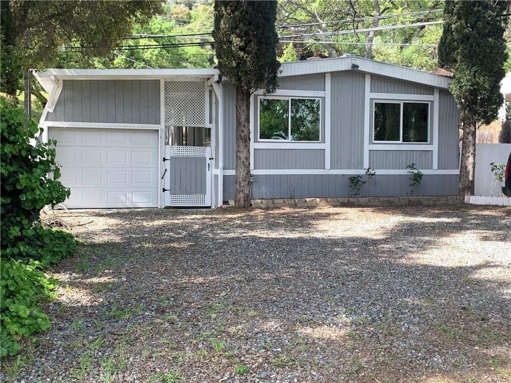All Furniture, decorations, and appliances included in sale. Great central location in Lake County on the shores of Clearlake Oaks. Home is directly across street from Clearlake, with nice Peek-a-Boo view of the water. 3 bedroom 2 bath open floor plan home, just over 1400 square feet of living space. Check out the LG refrigerator and GE Stainless Steel stove, yes kitchen appliances included. Priced to $ELL !! Clean, spacious, updated and modern, with new front windows ,flooring, mini splits keep the home at just the Right temperature throughout the year.
Laundry room includes washer and dryer with purchase. Two porches, private fenced yard, pull through tandem covered parking with automatic garage door opener, plenty of utilized space, room for your boat and your RV.
Come view this incredibly priced modern comfort home now.