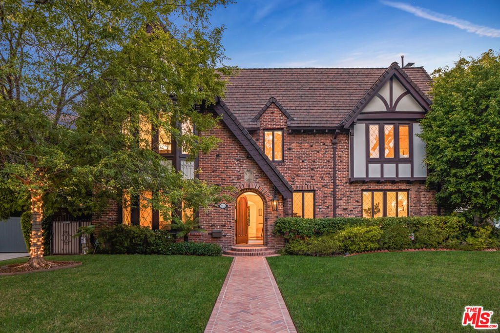 Superb Country English style home which offers exceptional livability in the middle of the most coveted neighborhood in LA. Sophisticated and stylish, featuring exquisite details and intricate moldings throughout. A beautiful sweeping staircase welcomes you into the home. This HPOZ Windsor Square stunner boasts 4 large bedrooms & 3 luxurious baths upstairs plus guest space with bath off garage. Impressive living and dining rooms with large leaded glass windows. The library looks out to the pool, spa, and yard. An open gourmet kitchen boasts a large center island, family room, powder room, and a sunny breakfast room which opens onto the covered dining area with built-in bbq. The upstairs landing has a bookshelf-lined niche with a window seat, laundry area & back staircase. Featuring a generously sized primary with a sitting area, fireplace, and 3 walk-in closets. The gorgeously appointed bath has dual sinks, a freestanding tub, and is flooded with natural light. Down the hall, you'll find a guest bedroom with an en-suite overlooking the yard. Two additional spacious guest bedrooms that share a Jack and Jill bathroom. The private backyard includes a Pergola-covered patio overlooking the large grassy yard, sparkling pool, and spa perfect for dinner parties! Lots of off-street parking. Close to the finest schools, Larchmont Village, and world-class shopping and dining completing this outstanding home.