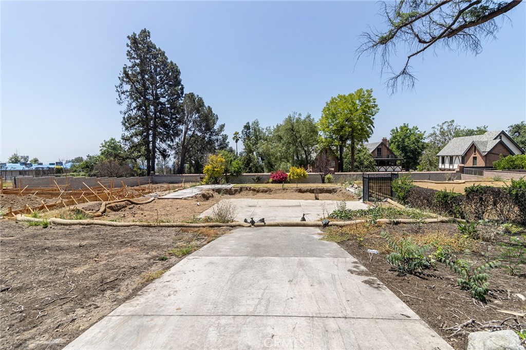 Introducing an exceptional opportunity to own land in one of Altadena’s most desirable foothill neighborhoods. This spacious lot, formerly the site of a single-family home lost in the Eaton Fire, is now cleared and professionally remediated, offering a clean slate for your dream home or investment project. Environmental remediation, including both Phase I and Phase II, has been completed through certified professionals under the oversight of the U.S. Army Corps of Engineers. Utilities were previously connected to the property, streamlining future development. Situated in a quiet residential area with stunning views of the San Gabriel Mountains, the location offers a perfect blend of nature and convenience. You’ll enjoy close access to hiking trails, parks, and local shops, all while being part of an established and revitalizing community. The lot next door is already under construction with a custom home, underscoring the neighborhood’s strong development potential. The property is owned free and clear, ensuring a smooth transaction for the buyer. Please note, all aspects of the property including zoning, lot size, utility access, permits, and rebuilding requirements should be independently verified with the county of Los Angeles. Don’t miss this rare chance to build in one of Altadena’s most scenic and promising areas!
