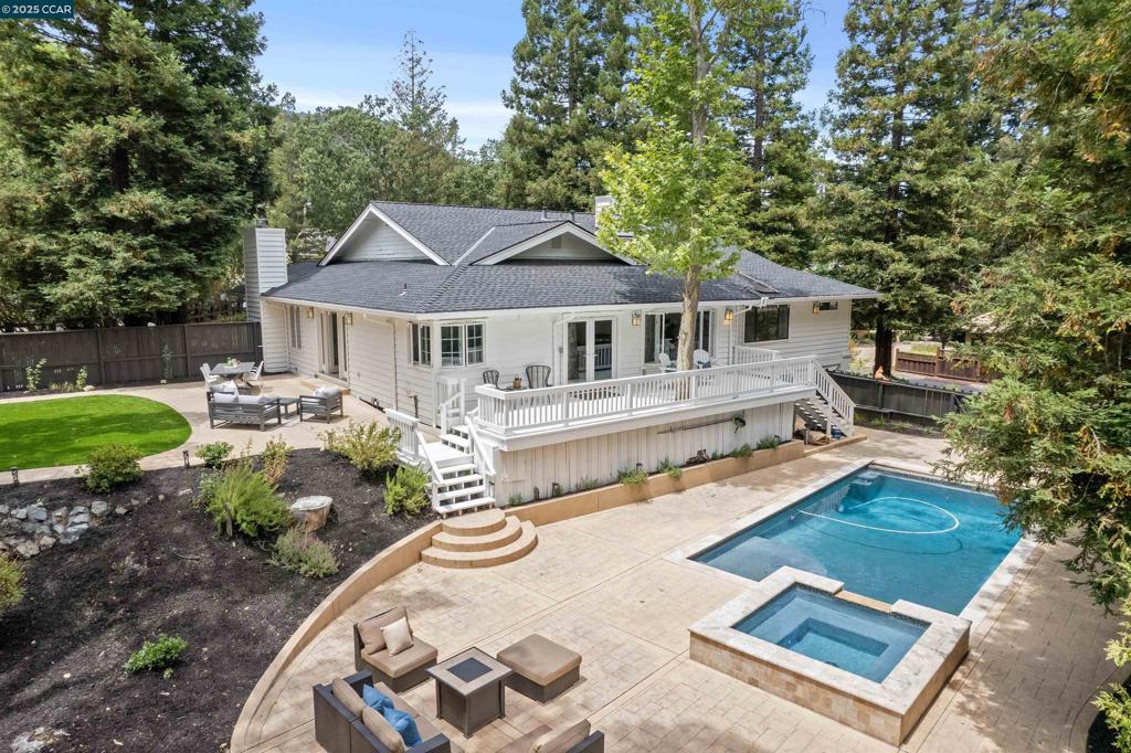 This charming, updated single story home is tucked at the end of a quiet court in one of Westside Danville's most coveted neighborhoods. Situated on a private .51 acre lot, this ranch style home features 4 spacious bedrooms, 3 recently remodeled bathrooms, plus a flexible bonus space ideal for a home office or recreation room. Recently refinished light oak hardwood flooring runs throughout much of the home, complemented by wide hallways that enhance the open floor plan. The kitchen opens to a large family room with access to the backyard deck. French doors from the dining room open to a generous patio and expansive flat turf lawn, leading to a stunning rectangular pool and spa. The living room has a volume ceiling and abundant natural light. The newly remodeled bathrooms are impeccably finished with on-trend designer touches. The 3 car garage and integral color concrete driveway and patios are extra features. Located in a private setting with exceptional curb appeal, this home offers unmatched walkability to downtown Danville, the popular Iron Horse Trail, and award-winning schools. This is Westside living at its best--serene, stylish and close to wonderful restaurants, shops and amenities.