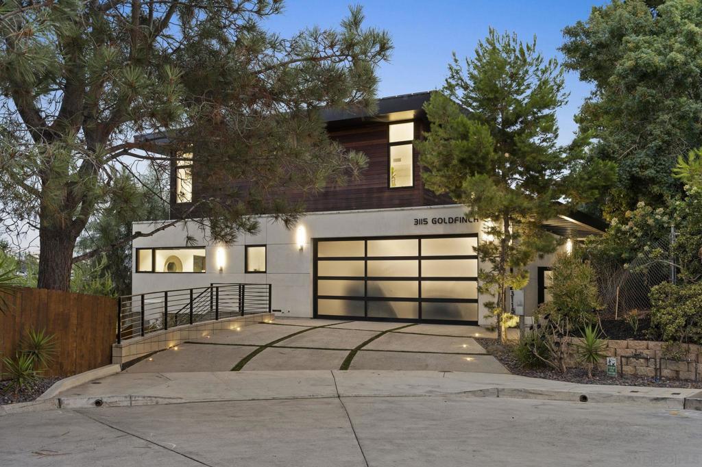 Tucked into the heart of Mission Hills, this sculptural residence redefines modern luxury with seamless indoor-outdoor flow, gallery-like design, and sun-drenched sophistication. You don’t just live here — you experience light, space, and movement like never before. Framed by expansive walls of glass, the open-plan layout blurs the lines between inside and out. A bold floating staircase anchors the living space like a modern art installation, while soft tones, organic textures, and architectural lines create a quiet elegance throughout. Whether you're entertaining guests in the sleek designer kitchen or soaking in panoramic views from the living room, every corner of this home tells a story of curated luxury and California ease. A space like this doesn’t just appear — it’s crafted. And it’s ready for someone who appreciates the intersection of intentional design and laid-back refinement.