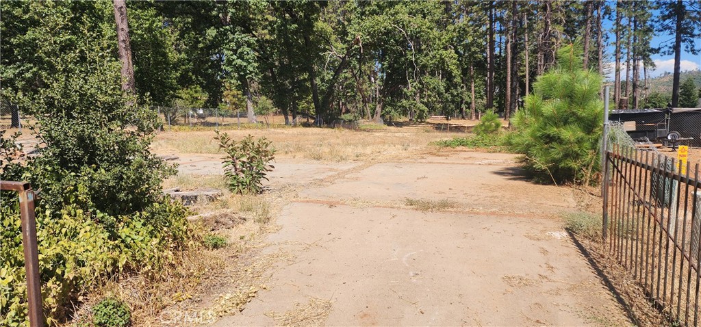 Nestled in the serene town of Paradise, California, this .28-acre partially fenced lot with concrete circle drive offers a unique opportunity to build your dream home in a peaceful, picturesque setting. Located on a quiet cul-de-sac, this property ensures privacy and minimal traffic, perfect for those seeking a tranquil lifestyle. This prime parcel is a blank canvas, ready for you to create a custom home tailored to your vision. Whether you’re dreaming of a cozy retreat or a modern masterpiece, this lot’s size and location offer flexibility for a variety of architectural styles. The cul-de-sac setting ensures a peaceful ambiance, perfect for families, retirees, or anyone looking to enjoy the charm of small-town living with the beauty of Northern California’s landscape. Explore nearby Bidwell Park, one of the largest municipal parks in the U.S., offering hiking, biking, and outdoor adventures. Enjoy the vibrant community of Paradise, known for its friendly atmosphere and local events. Quick access to Chico for additional dining, shopping, and entertainment options. Don’t miss this chance to own a piece of Paradise!