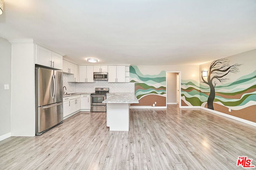 Welcome to this beautifully updated 2-bedroom, 1-bathroom upper-level condominium located in a quiet gated community in the heart of Reseda. This light-filled home offers an open floor plan with a spacious living room that flows seamlessly into the dining area and remodeled kitchen, complete with modern cabinetry and updated finishes. The unit features laminate wood-look flooring throughout, large windows bringing in natural light, and generous closet space in both bedrooms. The recently refreshed bathroom adds a touch of contemporary style. Community amenities include a sparkling swimming pool, well-maintained landscaped courtyard, and on-site laundry facilities. One assigned covered parking space is included. Conveniently situated near shopping, dining, schools, and public transportation, this move-in-ready condo is perfect for first-time buyers or investors looking for a low-maintenance property in a central San Fernando Valley location.