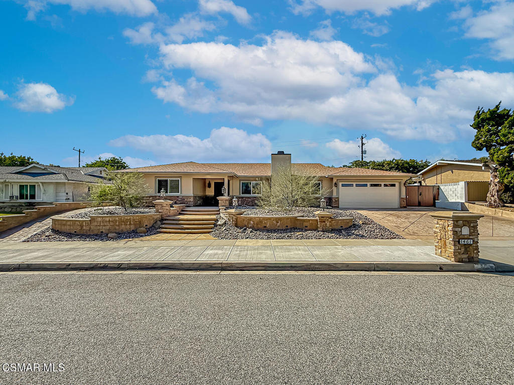 Thoroughly REMODELED Shadow Oaks Beauty with BEACH-ENTRY Pool, Dual Primary Suites, MASSIVE custom kitchen, and a PRIVATE Backyard Oasis! Taken down to the STUDS in 2017 and transformed from top to bottom, this 4-bedroom, 3-bathroom home offers 2,649 SqFt of reimagined living space on a lushly landscaped 8,900 SqFt lot in one of Thousand Oaks' most coveted neighborhoods--Shadow Oaks! Every inch of this home has been thoughtfully updated with quality finishes, structural upgrades, and high-function layout improvements that elevate both form and function. Curb appeal is off the charts thanks to an ELEGANTLY reworked exterior showcasing drought-tolerant landscaping, GORGEOUS stone trim, smooth stucco finish, redone stamped-colored concrete driveway, beautifully designed hardscaping and paths, and a REGAL front porch entry that sets a warm and welcoming tone. Step through the upgraded front door with sidelights into a space bathed in NATURAL LIGHT and grounded by timeless design choices like crown molding, stone tile flooring, and designer fixtures. The Living Room is LEVEL with the rest of the home (no step-down!), offering rich engineered wood flooring, recessed lighting, and plantation-shuttered windows that fill the room with brightness. The OPEN-CONCEPT Kitchen & Dining Room area was COMPLETELY restructured for maximum style and usability. Designed with entertaining in mind, the space showcases granite countertops, custom soft-close cabinetry with pull-outs, a beautiful stone-tile backsplashes with mosaic tile trims, and an ENORMOUS center island with breakfast bar seating and hidden storage galore. A Frigidaire 5-burner gas range with DOUBLE ovens makes holiday hosting a breeze, while the Frigidaire Professional convection oven/microwave combo adds a touch of culinary luxury. Lots of pantry space + additional flatware/glassware cabinetry at the Dining Room complete this entertainer's dream. This home boasts TWO Primary Suites--ideal for multigenerational living or luxe guest accommodations. The newer rear Primary Suite is a PRIVATE RETREAT with VAULTED ceilings, a walk-in closet with built-in organizers, and direct backyard access through plantation-shuttered French doors. The en-suite bathroom dazzles with dual-sink granite vanity, a deep soaking tub in a stone surround, and a LARGE stone-tiled walk-in shower. The original front Primary Bedroom offers wood-like flooring, its own WALK-IN closet, and a fully remodeled en-suite bath with stone-tiled walk-in shower and frameless glass doors. Two additional Secondary Bedrooms provide great guest or family accommodations, both featuring fresh carpet, ceiling fans, plantation shutters, recessed lighting, and upgraded bifold closet doors. The Hall Bathroom continues the stylish theme with dual-sink granite vanity, stone tile flooring, and a redone tub/shower combo with sleek fixtures. The 2-car garage is directly accessible from inside and includes ceramic tile flooring, drywalled ceilings & walls, epoxy floor coating, a finished laundry area with tile flooring and backyard access, ceiling-mounted Gorilla racks, and even a newer garage door! Step outside into a COMPLETELY private, resort-style backyard that was purposefully transformed into a low-maintenance, high-lifestyle paradise. Enjoy a luxurious in-ground SPA and BEACH-ENTRY POOL, stacked-stone BBQ island with concrete countertops and Turbo Elite stainless-steel grill, sprawling paver-stone patios (both covered & uncovered), artificial turf lawn, and TALL privacy fencing that surround you in peaceful seclusion. Additional MAJOR UPGRADES include: a NEWER ROOF, an upgraded electrical panel + subpanel + wiring, a NEW furnace, AC coil, and ductwork, and Milgard dual-pane windows! Enjoy WALKABILITY to Acacia Magnet School and Redwood Middle School, with close proximity to Aspen Elementary, Thousand Oaks High, the outstanding Wildwood hiking & biking trails and tennis courts, and all the shopping and dining of Janss Marketplace!