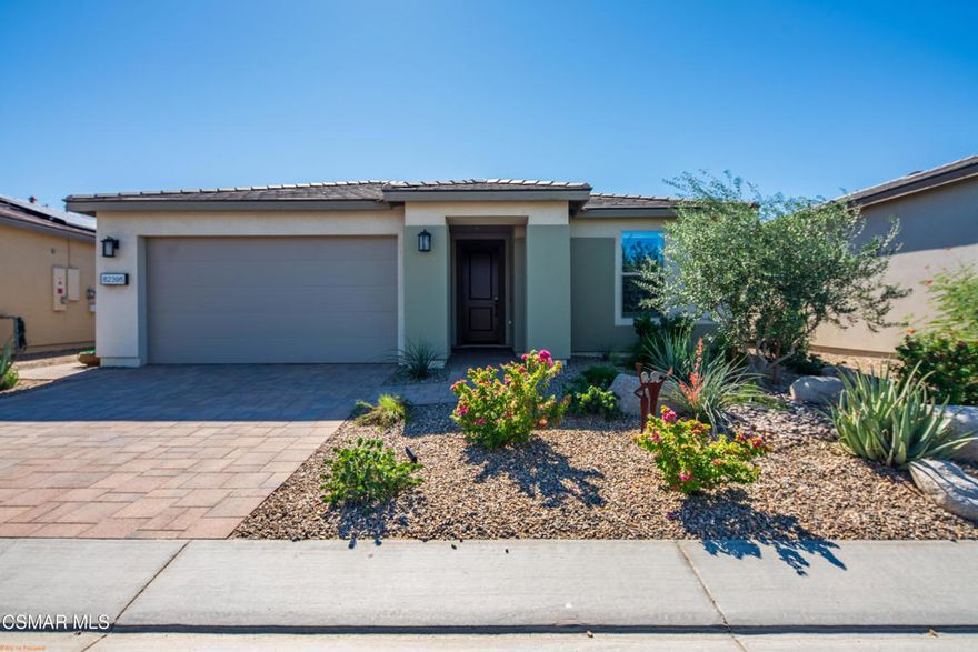 A must see ! Built in 2023. Located inside the beautiful gates of Trilogy Polo Club 55 + community. This home Amazing curb appeal features paver driveway and professionally designed landscaping meticulously kept Connect Plan 3 bedrooms and an office, large laundryroom with smart space. 2 full baths and a open concept floorpan which features a large island with quartz counter tops, G.E. Profile stainless steel appliances, built in microwave ,large sink, spacious pantry, with beautiful back splash. You will enjoy cooking for sure. Primary suite with large windows looking out to the backyard. Custom walk-in shower with lovely tile, double vanity, huge walk-in custom closet plenty of room. Window treatments include shutters through out, plus a Retractable shade in great room along sliding doors which leads out to the backyard that has a covered patio and an amazingpool. Not to forget about a tanning shelf and spa with so much privacy. Paver deck work and patio, lovely landscaping and outdoor lighting for entertaining family and friends. Opt. club transfer fee. (Vs. new Membership $12,000) Club amenities include tennis, pickleball courts, fitness center, resort lap pools and huge lounging pool, poker, billiards room, restaurant and culinary, artisan studios, Community features putting green, bocce ball courts, chess game area.This home has SOLAR Systems that is paid for, equipped with smart features. 2 car garage with A/C. This home is truly one of a kind enjoy the indoor outdoor living in the beautiful desert.