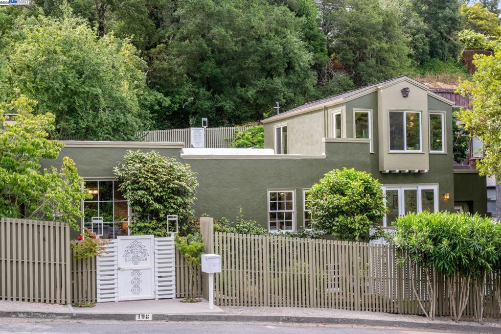 Exquisite design and modern comforts await in this completely reimagined, level-in 3+BD/2.5BA in the lower Berkeley Hills. This elegant 2036 SQFT home features a hybrid of elegant and playful upgrades and stunning original details. Step into the open floor plan with a living room boasting a coffered ceiling, fireplace with copper hood, mullioned windows and refinished hardwood floors that span into the kitchen and dining area. The eat-in kitchen includes custom paneled appliances, quartz waterfall counters, and fresh new cabinets coupled with the original copper hardware. The family room’s French doors open onto a deck for indoor/outdoor living. The stunning two-level primary suite offers a soaring ceiling, spiral staircase to a sleeping loft, peek-a-boo bridge views, two large closets, and a gorgeous ensuite bath with dual vanity. Another bedroom enjoys garden views with a chic modern hall bath with heated floors and bench. A third bedroom features custom shelving, a half bath and dedicated doors to the garden. Relax in the lovely outdoors with majestic redwood, new retaining walls and stairs, and 220’ designer fire-resistant fencing, and off-street parking. Explore the serenity of local paths, walking access to three local parks and the world-class amenities of North Berkeley.