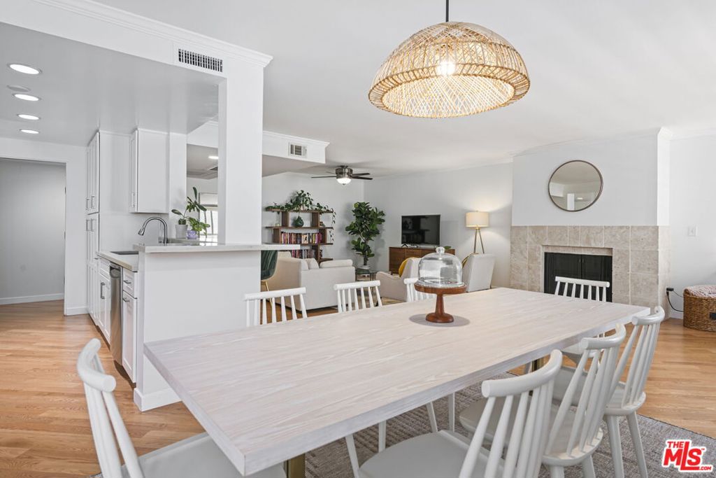 Discover this beautifully updated 1 bed/1 bath condo in a prime Brentwood location, just steps from San Vicente's best retail, coffee shops, and restaurants (Whole Foods, Jon & Vinny's, Starbucks). Enjoy an open floor plan with a living room, fireplace, and a flexible den area. A sliding door leads to a large, tiled balcony overlooking the courtyard patio and pool. The newly remodeled designer kitchen boasts quartz countertops, new cabinetry, and stainless steel appliances with a breakfast bar.The oversized primary bedroom features crown molding, new carpet, and a custom walk-in closet. The updated full bath includes a granite-top sink and glass shower. Additional features: new hardwood flooring, central A/C, and fresh paint.Includes gated parking with storage. Available now!